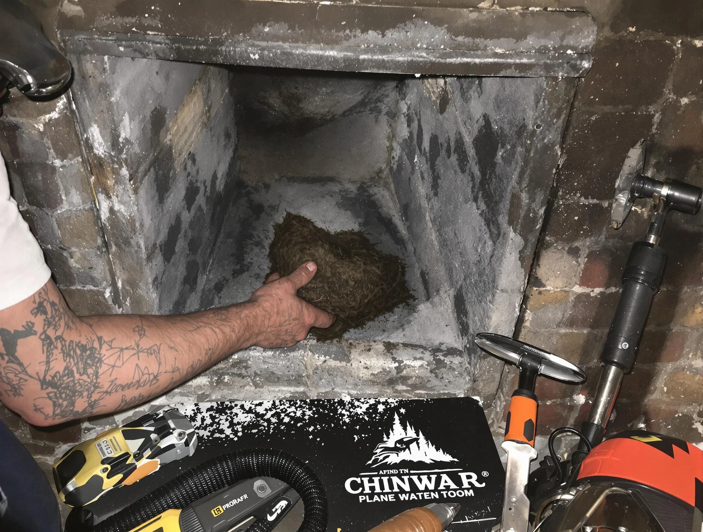 Oneonta Chimney Sweep safely removing debris and screening chimney in Oneonta, AL